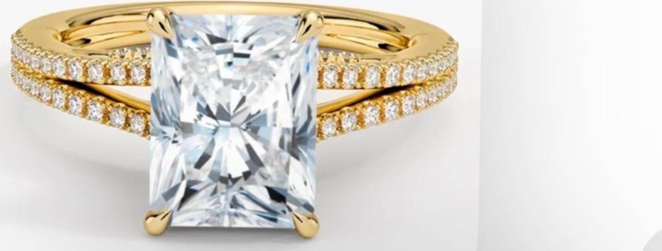 Radiant-cut diamond in a yellow-gold split-shank pavé setting